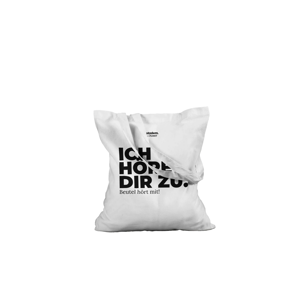 Weißer Stoffbeutel „Ich höre dir zu.“ liegend